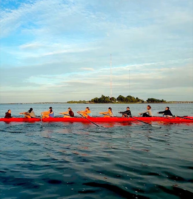The U16 eight in orange, Hart Island behind