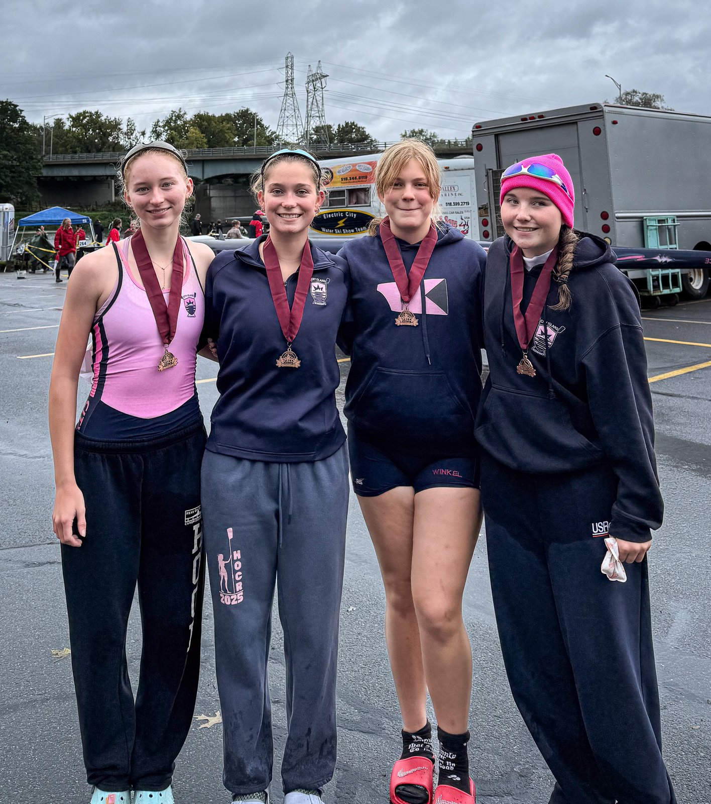 The quad with their bronze medals