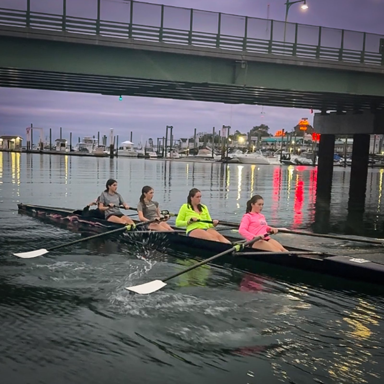 A quad in hi-vis under the bridge