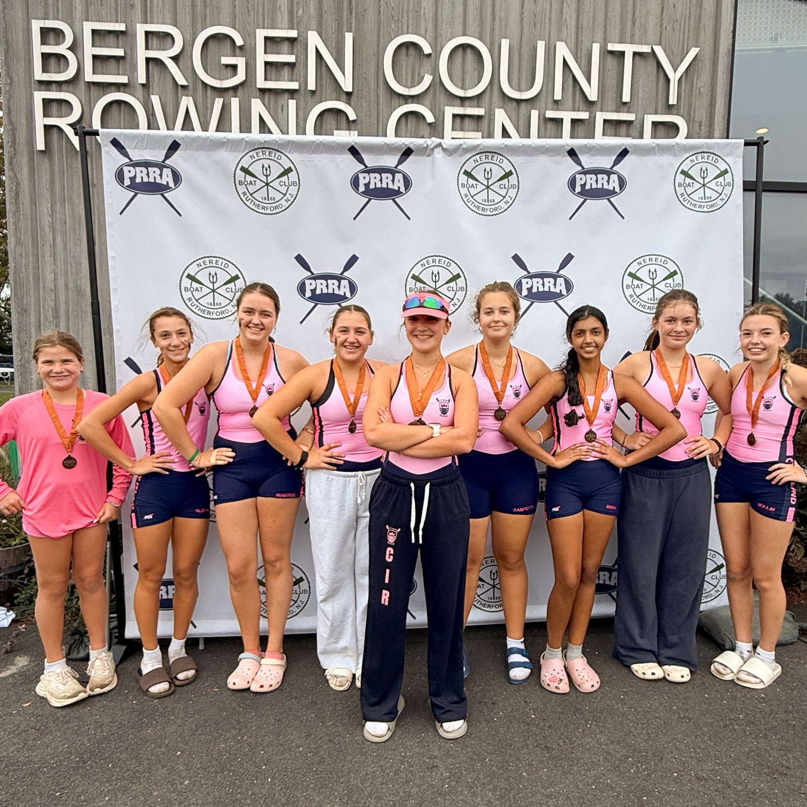 The Novice 8+ with their bronze medals