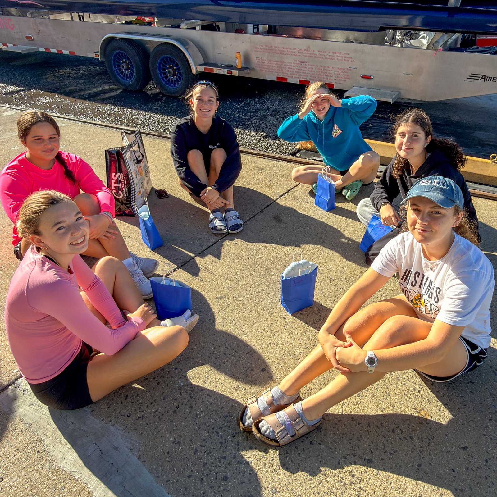 A sister group gathered in front of the trailer